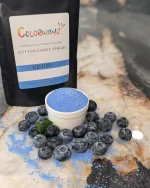 Colorwayz Blueberry Cotton Candy Sugar bag next to a bowl of sugar surrounded by fresh blueberries, perfect for making natural, blue-colored cotton candy.