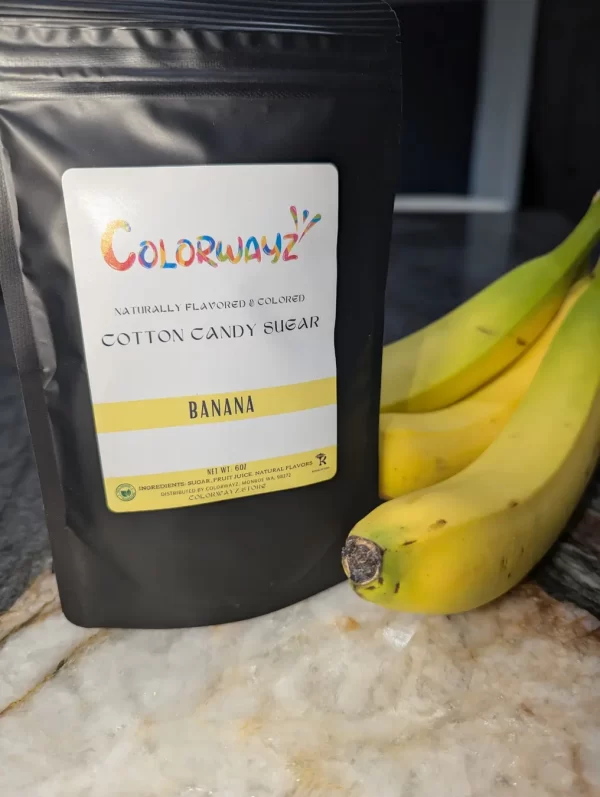 Colorwayz Banana Cotton Candy Sugar with fresh bananas, highlighting the natural ingredients used in this fun, fruity cotton candy flavor.